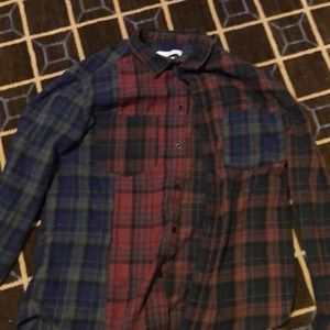 Used. Maroon, navy, dark green, and beige flannel.